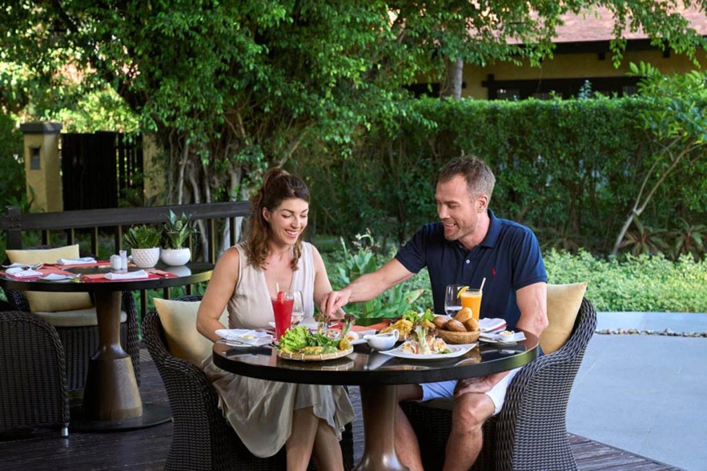 Dining in the tropical garden at Anantara Mui Ne